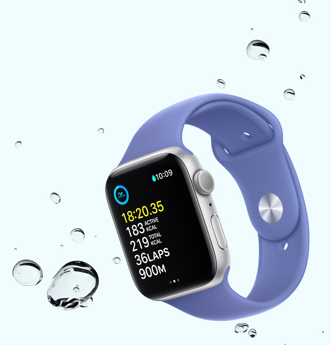 Apple Watch SE displaying a swim workout screen with water droplets near the device